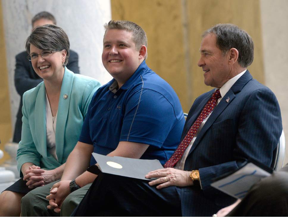 Al Hartmann  |  The Salt Lake Tribune
Gov. Gary Herbert, right, sits with Nathan Rose a participant in the Pathways Project and Tammy Pyfer, Education Advisor Tuesday March 21 in the capitol rotunda where he announced the new Talent Ready Utah executive board and launched the grant application process.