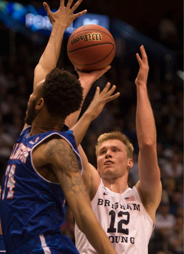 Rick Egan  |  Tribune file photo
BYU center Eric Mika, shooting over UT Arlington's Faith Pope in the NIT last week, says he expects to be drafted and hopes to play power forward in the NBA.