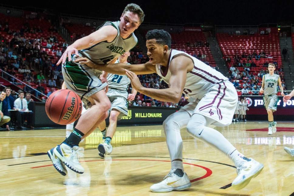 Chris Detrick  |  The Salt Lake Tribune
Lone Peak's Frank Jackson (15) and Copper Hills' Stockton Shorts (12) go for the ball during the 5A boy's basketball tournament at the Huntsman Center at the University of Utah Thursday March 3, 2016. Copper Hills is winning the game 33-22 at halftime.