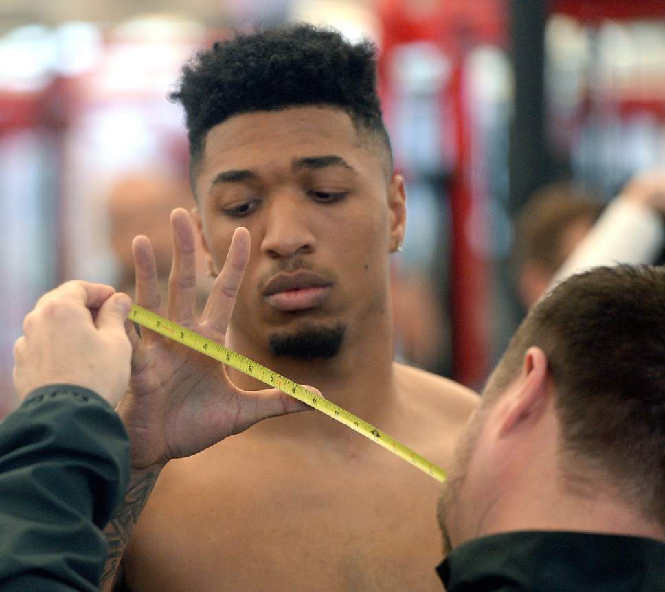 Al Hartmann  |  The Salt Lake Tribune
University of Utah football wide reciever and NFL Draft hopeful Tim Patrick gets his hands measured  before moving on to lift weights and run field drills to prove to NFL teams that he's ready to fight for a job Thursday March 23.