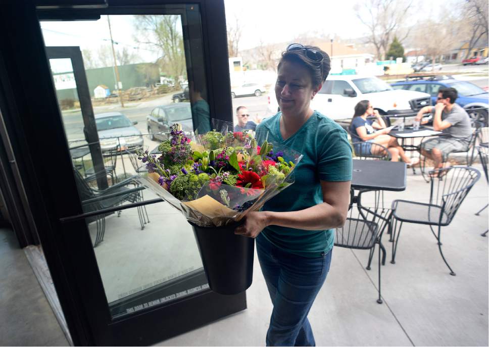 Scott Sommerdorf | The Salt Lake Tribune
Meditrina owner Jennifer Gilroy brings in flowers for a special event, Sunday, March 19, 2017.