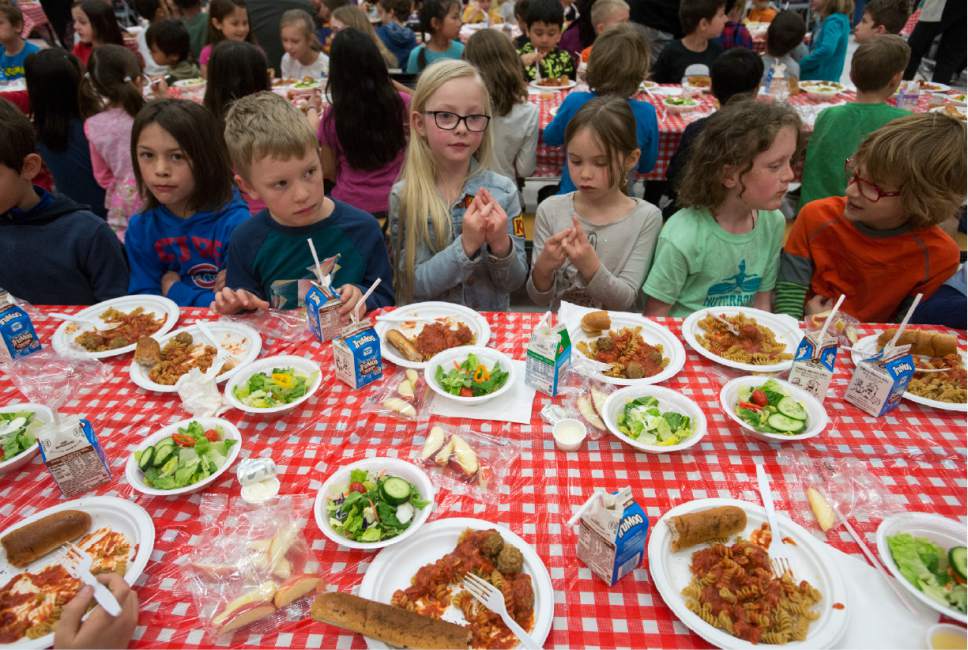 Rick Egan  |  The Salt Lake Tribune

Students at Wasatch Elementary School eat their lunch as opera performers sing to them, during a special "etiquette" Italian luncheon, Friday, March 24, 2017.