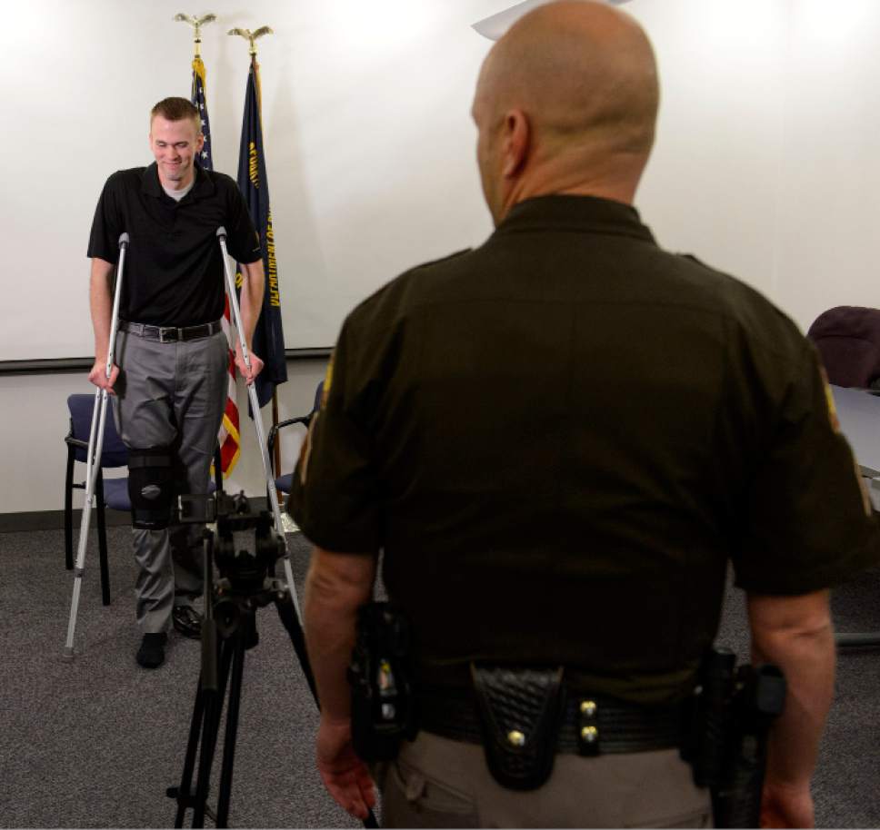 Steve Griffin  |  The Salt Lake Tribune


Utah Highway Patrol Trooper Devyn Gurney stands on his crutches after he and his wife Summer, talked about the events on March 6, 2017 when he was struck by a vehicle during a traffic stop on I-15 in Utah County. Trooper Gurney was released from the hospital a couple days later and is recovering from his injuries. The couple spoke with he media at the Utah Highway Patrol offices in Murray Thursday March 23, 2017.