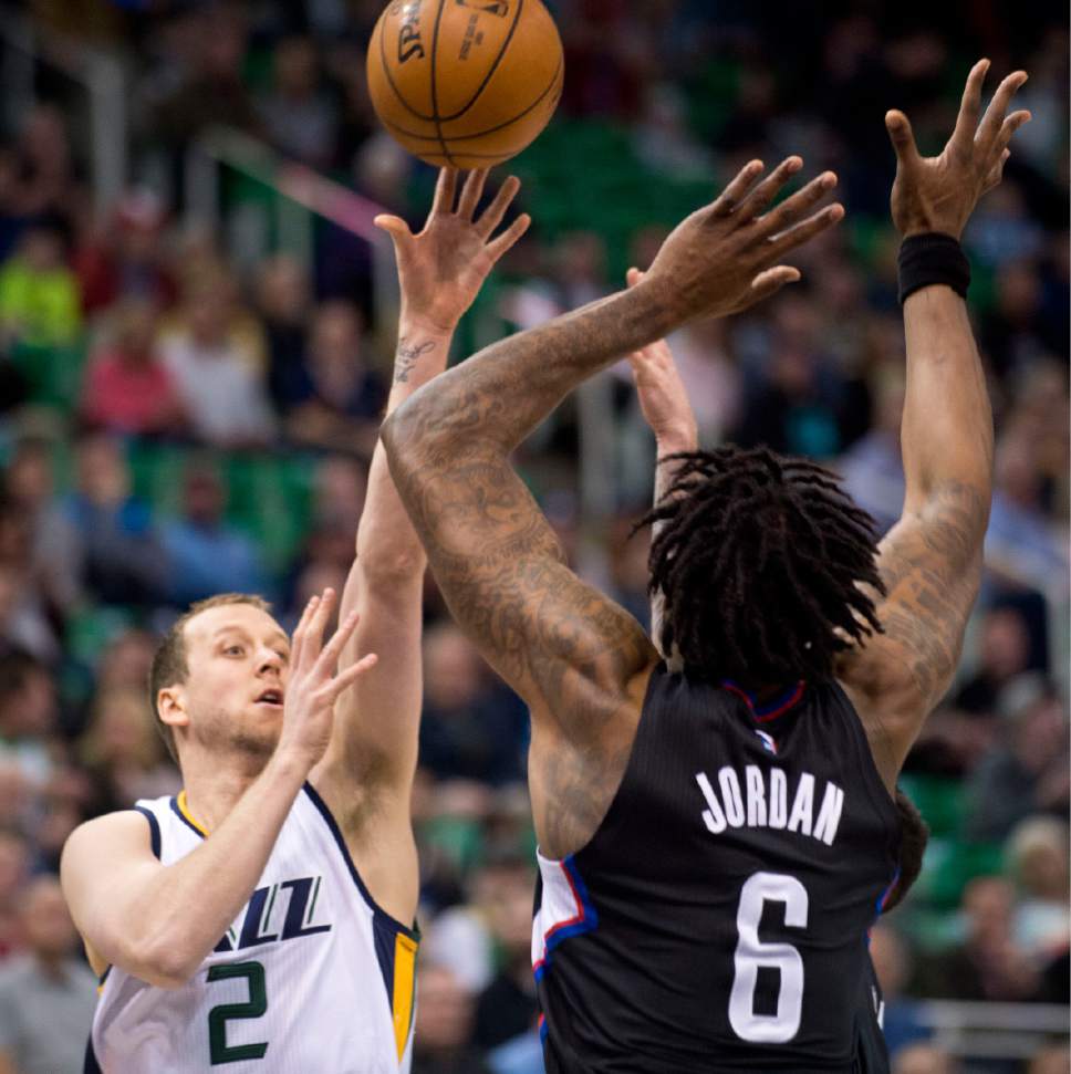 Lennie Mahler  |  The Salt Lake Tribune

Joe Ingles passes over DeAndre Jordan in the first half of a game between the Utah Jazz and the LA Clippers at Vivint Smart Home Arena, Monday, Feb. 13, 2017.