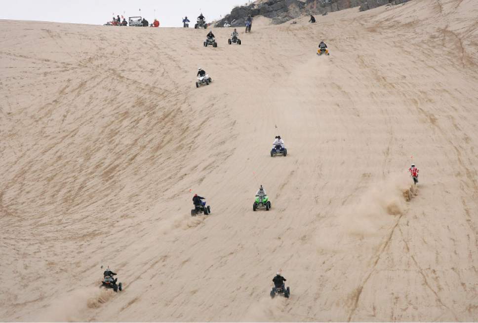 Scott Sommerdorf  |  Tribune file photo

A variety of vehicles power up the "Sand Mountain" incline at Little Sahara Recreation Area.