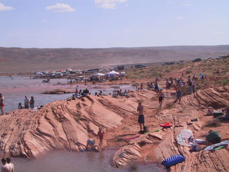 Mark Havnes  |  Tribune File Photo

Crowds at the rocky shore line at Sand Hollow State Park near St. George.