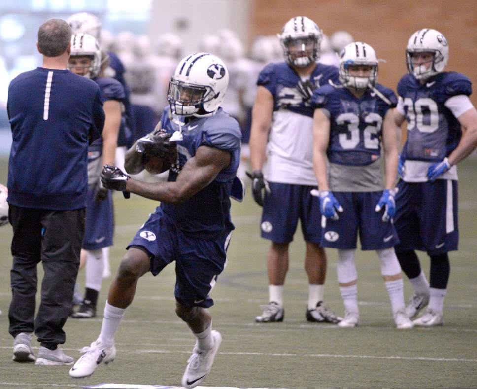 Al Hartmann  |  The Salt Lake Tribune
Running back Squally Canada, a transfer from Washington State who will be eligible this season works out with BYU running backs Tuesday March 22.