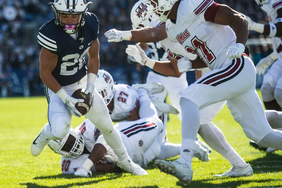 Chris Detrick  |  The Salt Lake Tribune
Brigham Young Cougars running back KJ Hall (20) scores a touchdown past Massachusetts Minutemen defensive lineman Ali Ali-Musa (90) and Massachusetts Minutemen safety Khary Bailey-Smith (21) during the game at LaVell Edwards Stadium Saturday November 19, 2016.