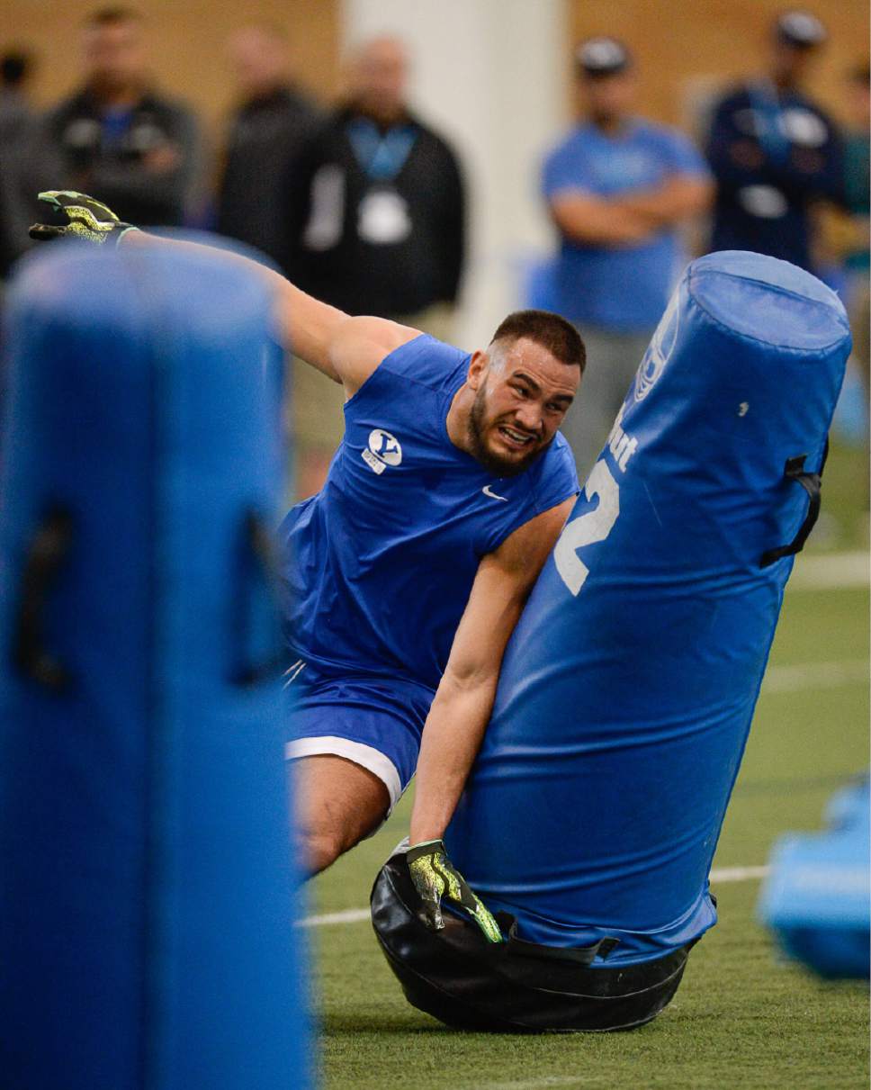 Francisco Kjolseth | The Salt Lake Tribune
Defensive Linebacker Sae Tautu pushes through drills as BYU's Pro Day kicks off at the indoor practice facility with seniors performing in front of NFL scouts.