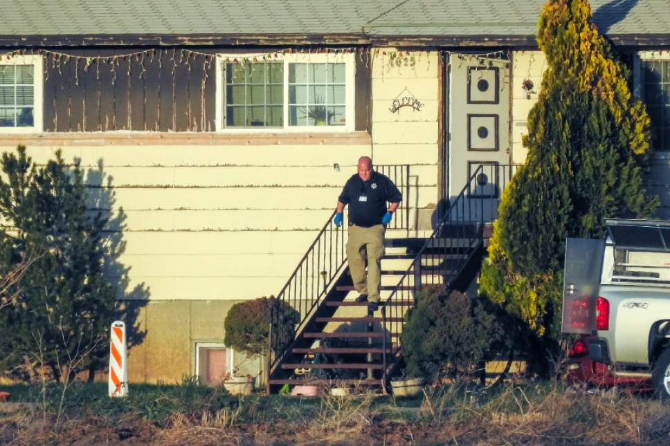 Chris Detrick  |  The Salt Lake Tribune
Members of the Utah County Sheriff's Department investigate the scene of an apparent murder-suicide in Benjamin, Utah, Friday, March 24, 2017.  A Salt Lake County sheriff's deputy and his nephew were found dead at a home near Spanish Fork on Friday, and Utah County deputies were investigating. Police identified the men as Salt Lake County Sheriff's Sgt. Chad Elwood Conrad, 42, and Conrad's nephew, Damon Brian Bushman, 23. Both men lived in the home, a Utah County Sheriff's Office news release said. Conrad worked in corrections.
