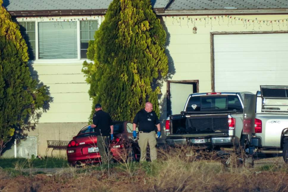 Chris Detrick  |  The Salt Lake Tribune
Members of the Utah County Sheriff's Department investigate the scene of a murder-suicide in Benjamin, Utah Friday March 24, 2017.  A Salt Lake County sheriff's deputy and his nephew were found dead at a home near Spanish Fork on Friday, and Utah County deputies were investigating. Police identified the men as Salt Lake County Sheriff's Sgt. Chad Elwood Conrad, 42, and Conrad's nephew, Damon Brian Bushman, 23. Both men lived in the home, a Utah County Sheriff's Office news release said. Conrad worked in corrections.