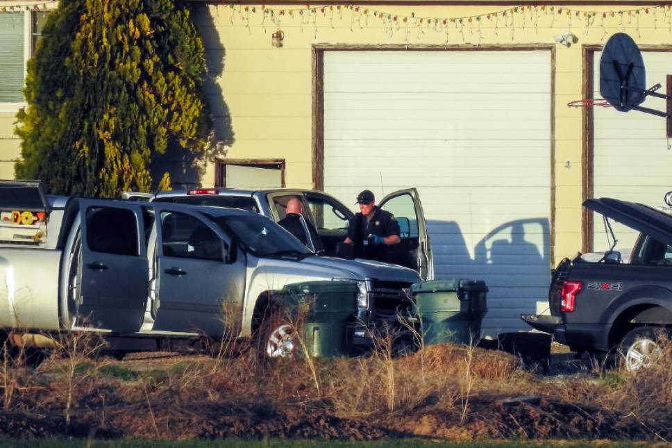Chris Detrick  |  The Salt Lake Tribune
Members of the Utah County Sheriff's Department investigate the scene of a murder-suicide in Benjamin, Utah Friday March 24, 2017.  A Salt Lake County sheriff's deputy and his nephew were found dead at a home near Spanish Fork on Friday, and Utah County deputies were investigating. Police identified the men as Salt Lake County Sheriff's Sgt. Chad Elwood Conrad, 42, and Conrad's nephew, Damon Brian Bushman, 23. Both men lived in the home, a Utah County Sheriff's Office news release said. Conrad worked in corrections.