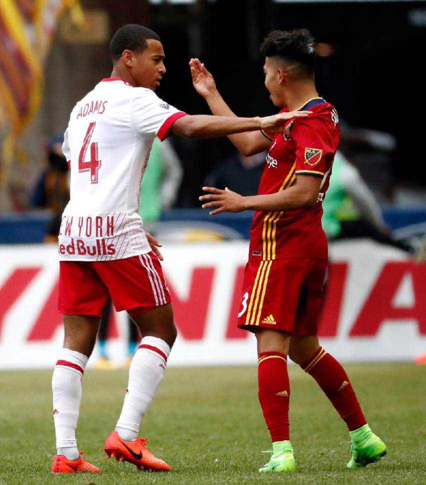 New York Red Bulls midfielder Tyler Adams (4) argues with Real Salt Lake midfielder Sebastian Saucedo (23) during the second half of an MLS soccer match, Saturday, March 25, 2017, in Harrison, N.J. The teams tied 0-0. (AP Photo/Julio Cortez)