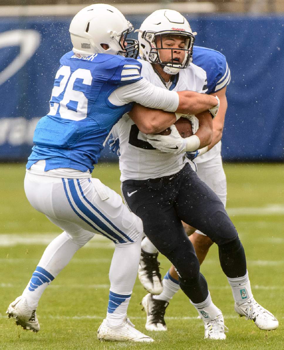 Trent Nelson  |  The Salt Lake Tribune
BYU's Caden Dortch tackles KJ Hall during the annual spring football scrimmage in Provo, Saturday March 25, 2017.