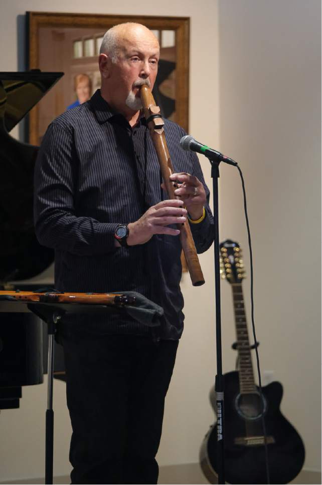 Francisco Kjolseth | The Salt Lake Tribune
Jim Walton performs "Hold On" dedicated to Melissa Cochran who was hurt in the recent terrorist attack in London that killed her husband Kurt. The Bountiful Davis Arts Center held an open mic memorial in his honor on Sunday, March 26, 2017.