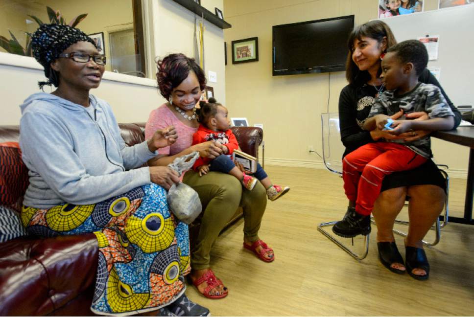 Steve Griffin  |  The Salt Lake Tribune


Women of the World executive director Samira Harnish, right, holds Junior Allahorem, 4, as she visits with Elizabeth Ngaba, Syntishe Ngaba and Blessing Ngaba, one year old,  during their visit to Women of the World a non-profit that seeks to help refugees in Salt Lake City Monday March 20, 2017.