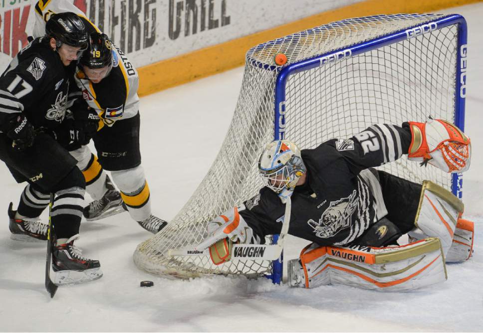 Francisco Kjolseth | The Salt Lake Tribune 
Utah Grizzlies goalie Ryan Faragher tries to stretch out for the puck while battling the Colorado Eagles in game 3 of the playoffs, at the Maverik Center in West Valley City, Thursday, April 21, 2016.