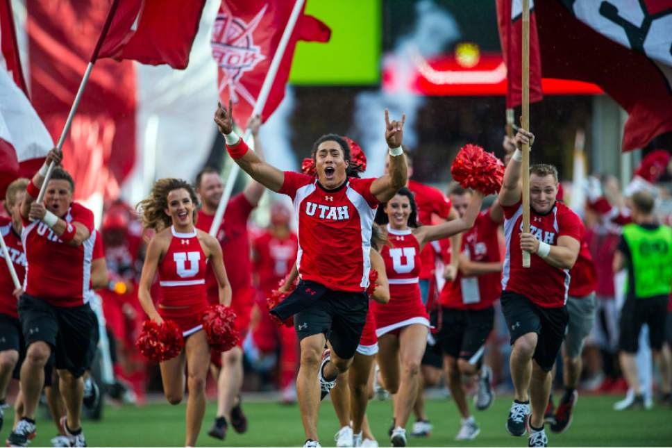 Chris Detrick  |  The Salt Lake Tribune
Utah cheerleaders run onto the field before the game at Rice-Eccles Stadium Thursday September 3, 2015.  Utah is winning 10-3 at halftime.
