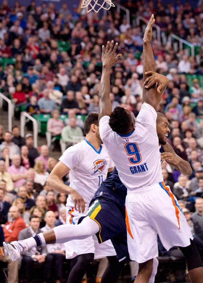Lennie Mahler  |  The Salt Lake Tribune

Derrick Favors loses control of the ball against Jerami Grant in a game against the Oklahoma City Thunder on Monday, Jan. 23, 2017, at Vivint Smart Home Arena in Salt Lake City.