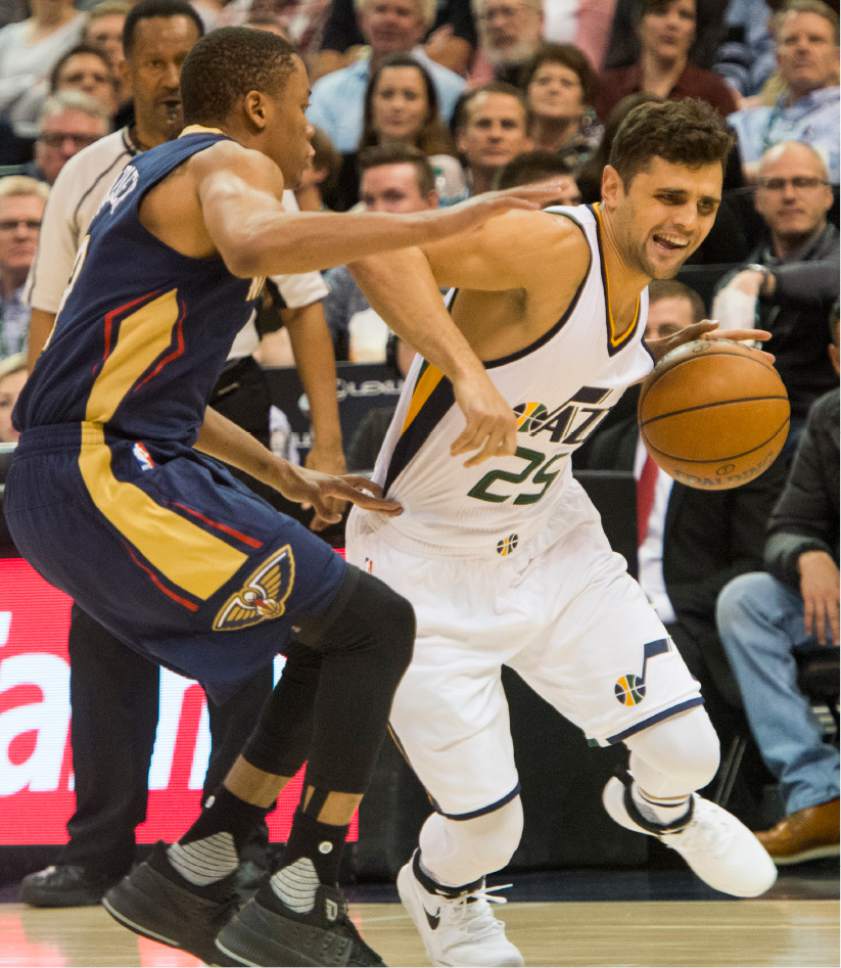 Rick Egan  |  The Salt Lake Tribune

Utah Jazz guard Raul Neto (25) takes the ball inside, as New Orleans Pelicans guard Tim Frazier (2) defends, in NBA action Utah Jazz vs. New Orleans Pelicans, in Salt Lake City, Monday, March 27, 2017.
