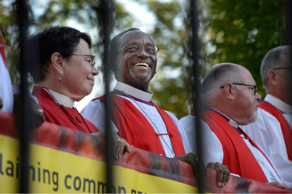 Scott Sommerdorf   |  The Salt Lake Tribune
Bishop Michael Curry of North Carolina, center, who was elected at the 27th Presiding Bishop of the Episcopal Church reacts during another speaker's comments after a march against gun violence held in Salt Lake City, Sunday, June 28, 2015.