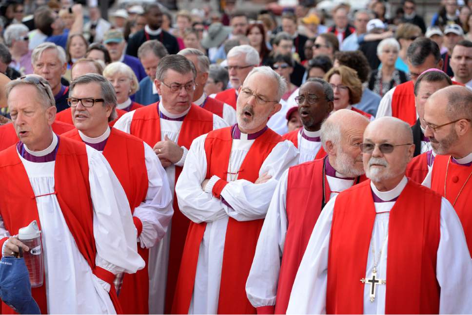 Scott Sommerdorf   |  The Salt Lake Tribune
Episcopal bishops sing prior to a march against gun violence by more than 60 Episcopal bishops and and about 2,000 in all, Sunday, June 28, 2015. The march started at The Salt Palace, went to Pioneer Park and returned to the Salt Palace - site of the General Convention of the Episcopal Church.