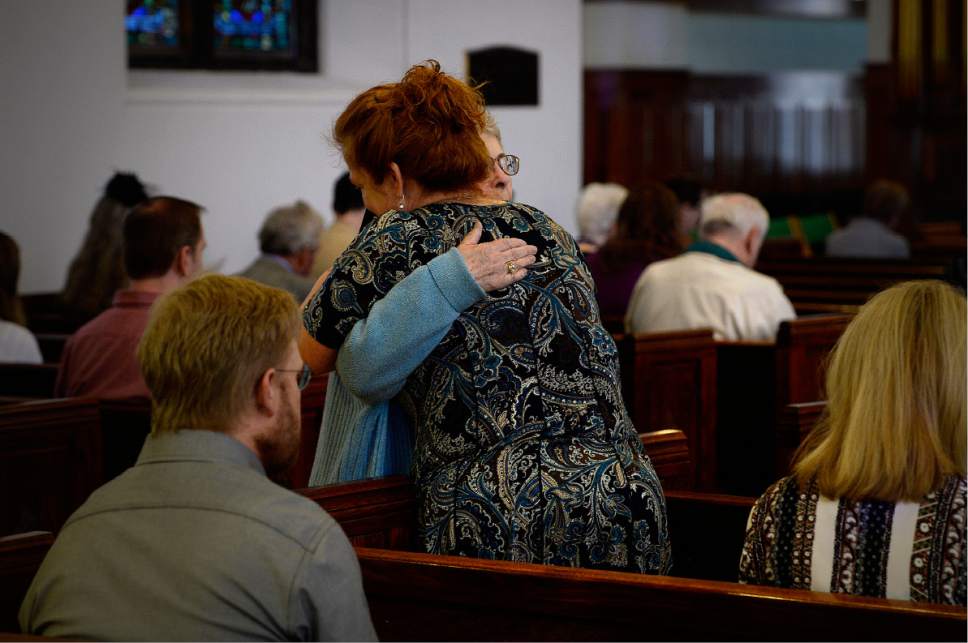 Scott Sommerdorf | The Salt Lake Tribune
Two parishioners embrace prior to Sunday service at St. Mark's Episcopal Cathedral, Sunday, March 19, 2017.