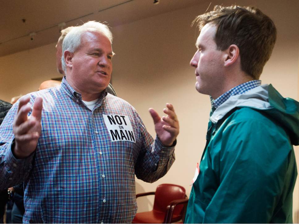 Rick Egan  |  The Salt Lake Tribune

Scott Drews (left) talks to Patrick Reimherr, Director of Government Relations and Senior Advisor for Salt Lake County, at the final open house, to discuss the two newly proposed shelter sites, Monday, March 27, 2017.
