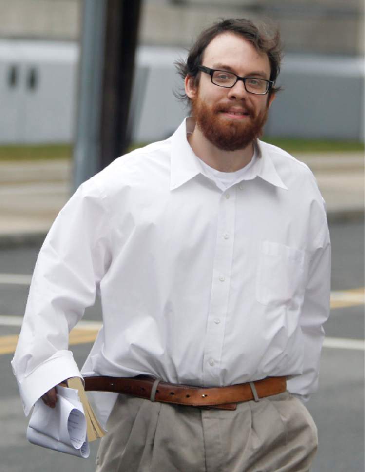 FILE - In this Feb. 28, 2011 file photo, Andrew Auernheimer leaves the Martin Luther King, Jr. Courthouse after posting bail in Newark, N.J. Auernheimer, a notorious computer hacker and internet troll associated with The Daily Stormer, scoffs at the notion that anyone can be harmed by "mean words on the internet." For him, anonymous trolling is a modern form of a generations-old, "distinctly American" political tactic. (AP Photo/Julio Cortez. File)