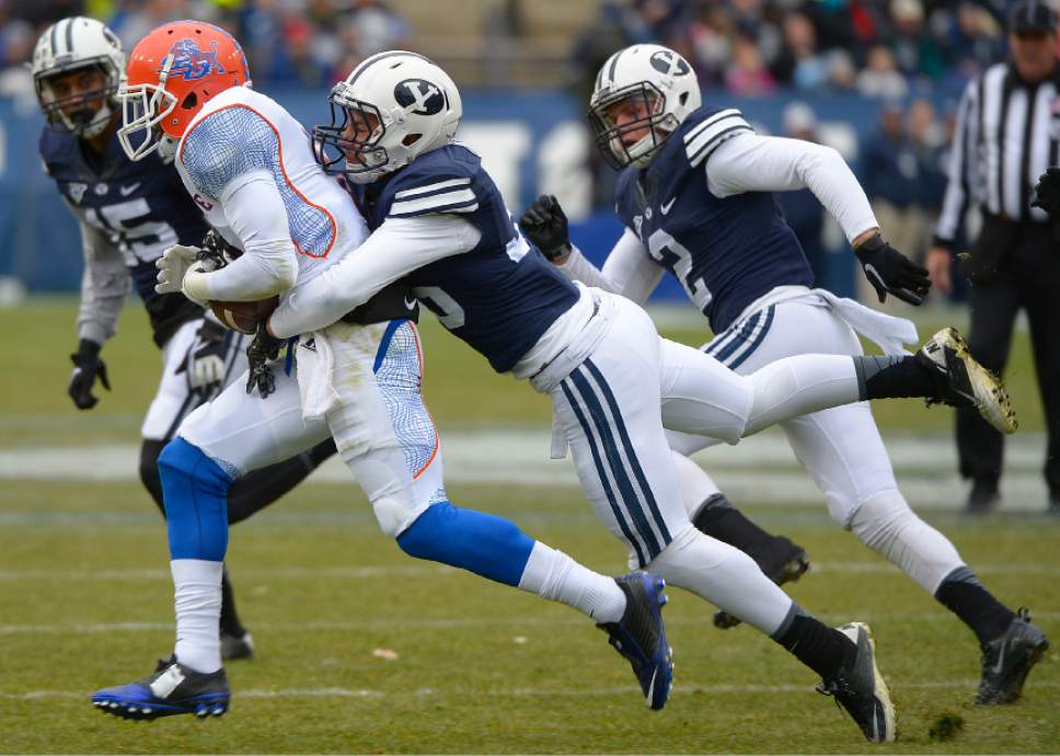 Leah Hogsten  |  The Salt Lake Tribune
Brigham Young Cougars defensive back Kavika Fonua (35) brings down Savannah State Tigers wide receiver Simon Heyward (8). Brigham Young University leads Savannah State 51-0 at the half, November 22, 2014, at LaVell Edwards Stadium in Provo.