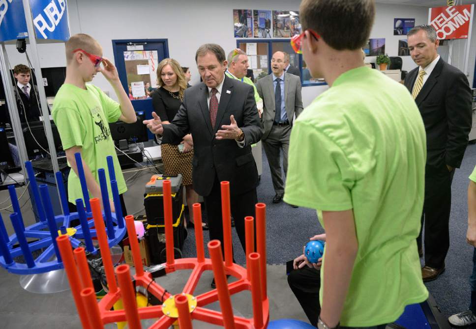 Al Hartmann  |  The Salt Lake Tribune
Gov. Gary Herbert gets schooled by students of the Velocity Raptors, a club of robot specialists at Oquirrh Hills Middle School in Riverton on Wednesday. During the visit, Herbert signed a series of education bills passed in this year's legislative session.