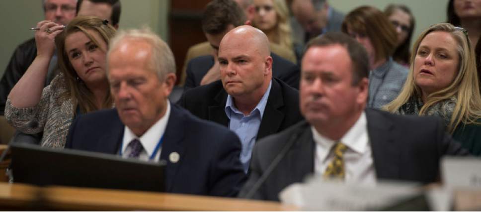 Steve Griffin  |  The Salt Lake Tribune

Polygamist Joe Darger, center, listens as Rep. Mike Noel, R-Kanab, left, present HB99 to members of the House Judiciary Standing Committee in the House Building Room 20 on Capitol Hill in Salt Lake City Wednesday February 1, 2017. HB99, signed into law on March 28, clarifies that polygamy is a felony in Utah.