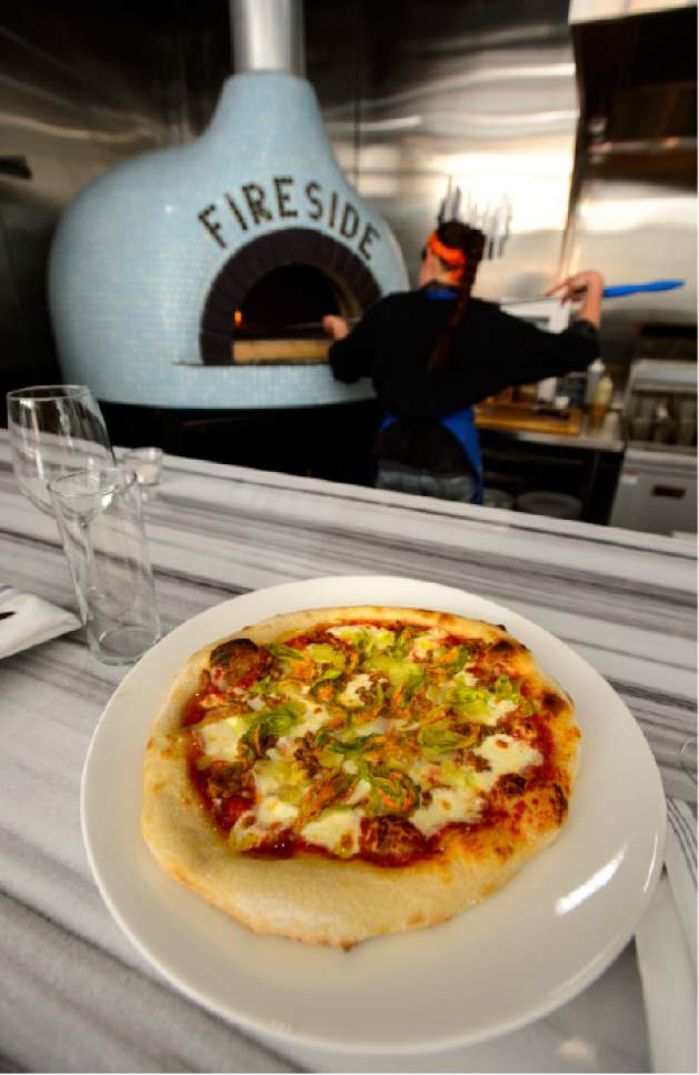 Steve Griffin  |  The Salt Lake Tribune


A fresh pizza is pulled from the Valoriani oven at Fireside on Regent in Salt Lake City on Friday, March 24, 2017. The restaurant, the first to open on the updated Regent Street, is attached to the backside of the new Eccles Theater.
