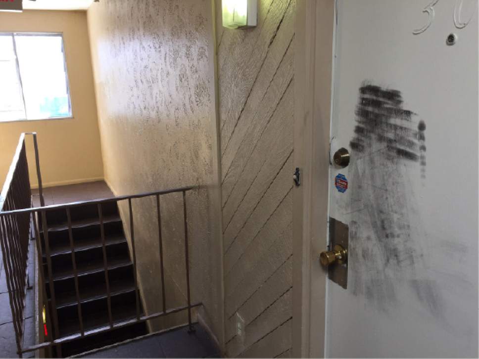 Luke Ramseth  |  The Salt Lake Tribune
Salt Lake City police responded to a fatal home invasion early Thursday at this apartment complex, 731 S. 300 East. The door to the third-floor apartment was kicked in.