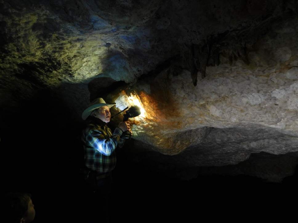 Erin Alberty  |  The Salt Lake Tribune

Jerald Bates holds his flashlight to show the translucent calcite formations in Crystal Ball Cave during a tour Feb. 20, 2017 in Gandy, Utah.