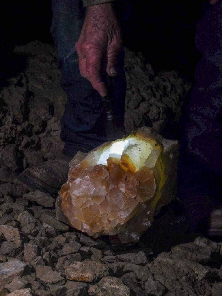 Erin Alberty  |  The Salt Lake Tribune

Jerald Bates' flashlight illuminates a translucent calcite formation in Crystal Ball Cave during a tour Feb. 20, 2017 in Gandy, Utah.
