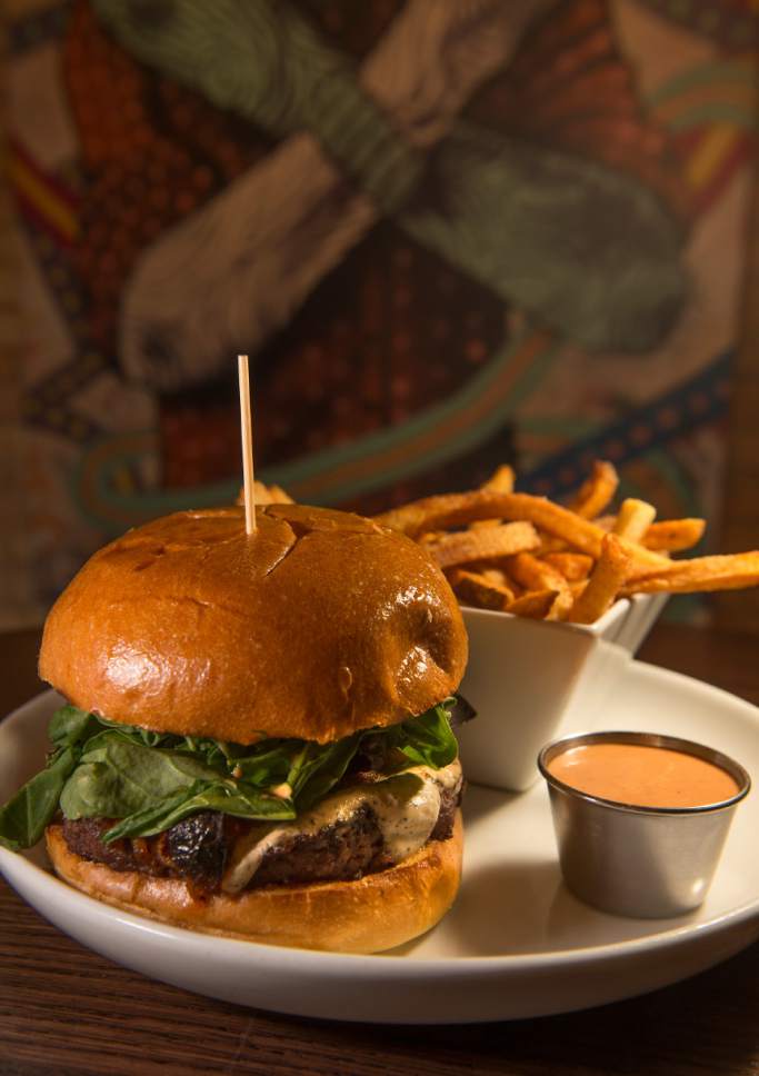 Leah Hogsten  |  The Salt Lake Tribune 
Black Sheep at Epic Brewing's Goat Burger, a bison patty with herb garlic goat cheese, portobello mushroom, red bell pepper, arugula and chipotle mayo.