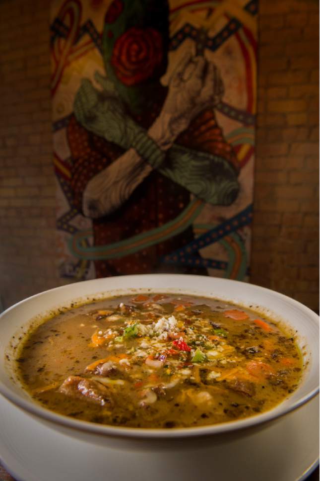 Leah Hogsten  |  The Salt Lake Tribune 
Black Sheep at Epic Brewing's Green Chile Stew, fire roasted green chile, braised pork, root vegetables, cheddar jack and sweet corn pico de gallo.