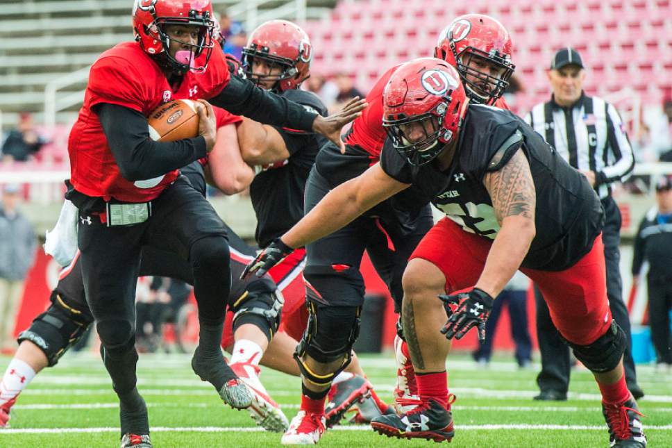 Chris Detrick  |  The Salt Lake Tribune
Utah Utes quarterback Troy Williams (3) runs for a touchdown past Utah Utes defensive tackle Alani Havili-Katoa (53) during a scrimmage at Rice-Eccles Stadium Friday March 31, 2017.