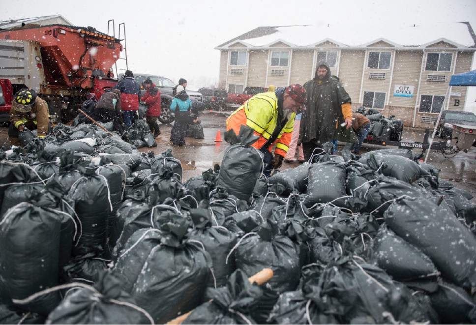 Lennie Mahler  |  The Salt Lake Tribune

Glen Gilles loads sandbags onto a flatbed truck to deliver to the Harbor Village neighborhood of Garden City, Utah, Friday, Feb. 10, 2017.
