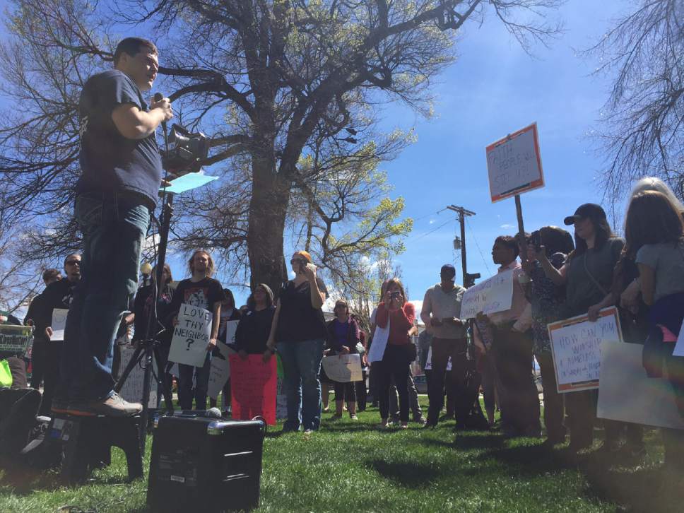 Josh Haas, a social work student at Utah State University, speaks to the crowd Saturday at a Pioneer Park demonstration backing Utah's homes population.

Luke Ramseth | Salt Lake Tribune