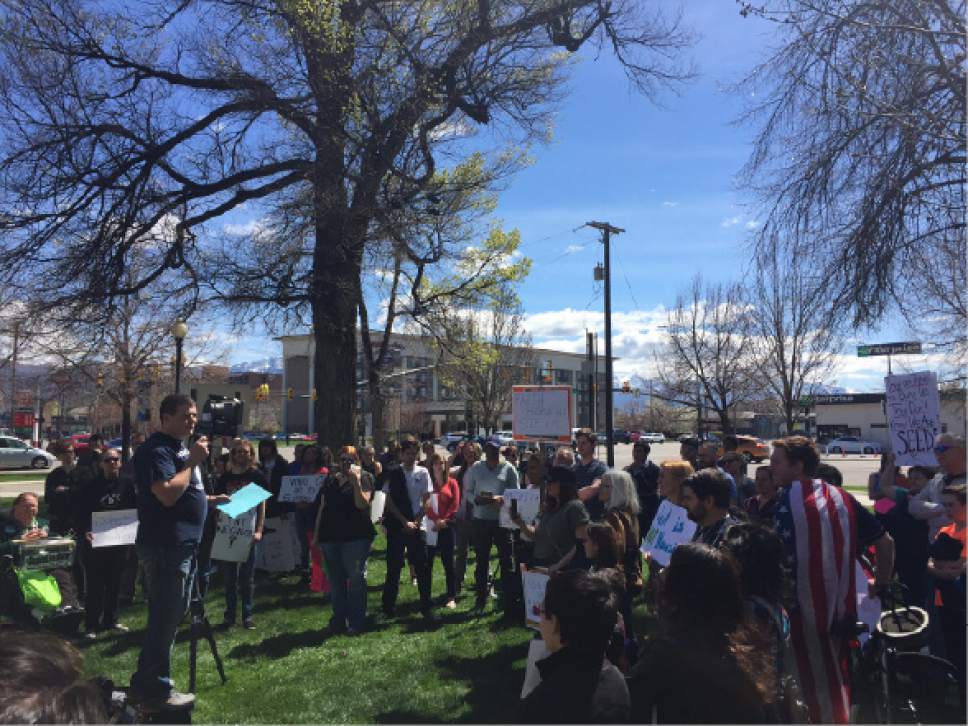 Luke Ramseth  |  The Salt Lake Tribune

Josh Haas, a social work student at Utah State University, speaks to the crowd Saturday at a Pioneer Park demonstration backing Utah's homes population.