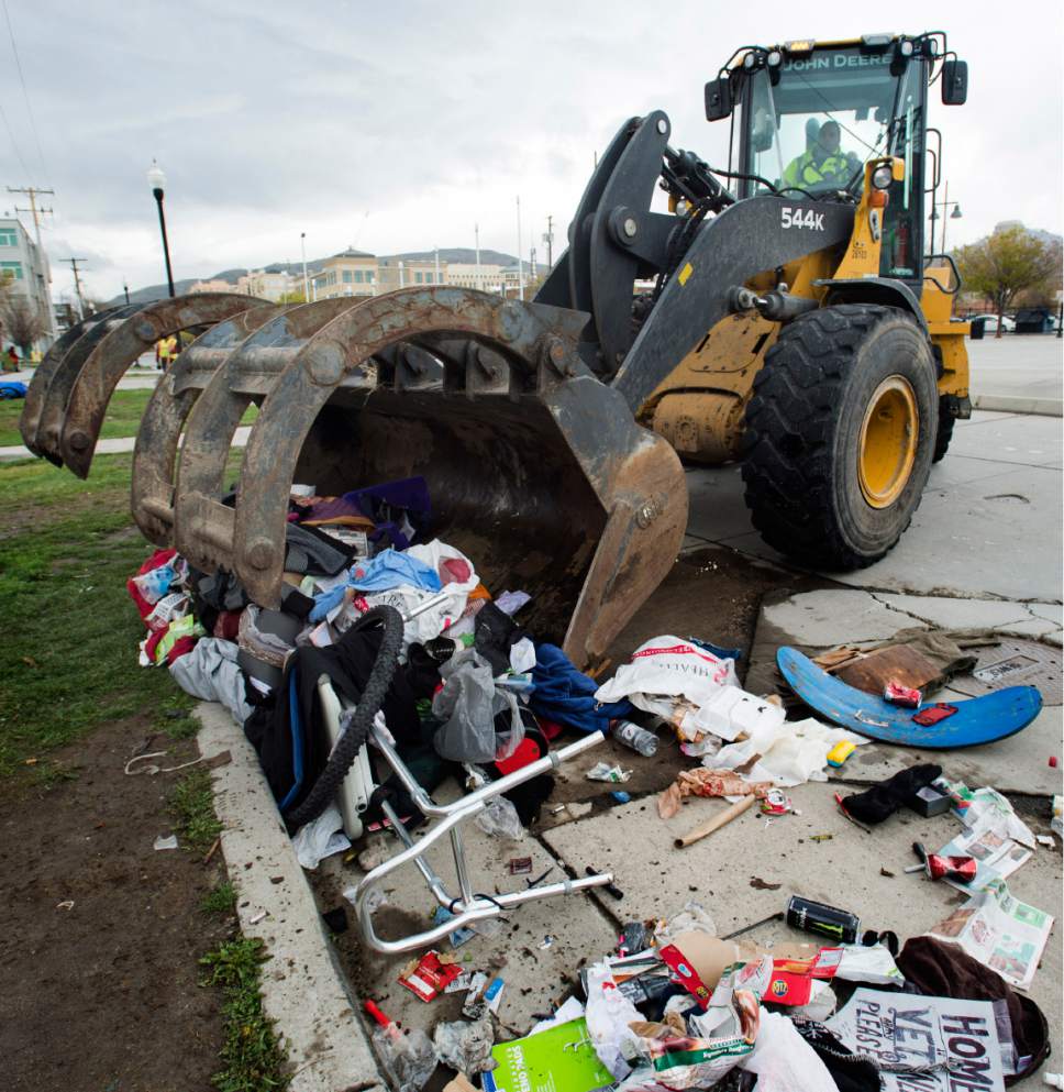 Rick Egan  |  The Salt Lake Tribune

Heavy equipment is used to clean up trash on 500 West, as workers from the Salt Lake County Health Department and Salt Lake City Waste and Recycling Division clean up campsites along the street. Friday, March 31, 2017.