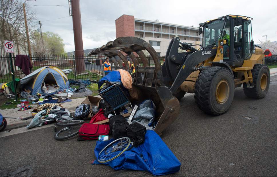 Rick Egan  |  The Salt Lake Tribune
Workers from the Salt Lake County Health Department and Salt Lake City Waste and Recycling Division, clean up campsites along 600 South on Friday.
