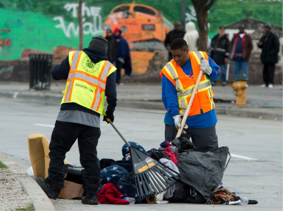 Rick Egan  |  The Salt Lake Tribune

Workers from the Salt Lake County Health Department and Salt Lake City Waste and Recycling Division clean up campsites along the street. Friday, March 31, 2017.