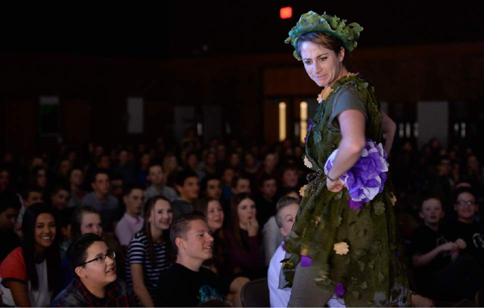 Francisco Kjolseth | The Salt Lake Tribune
Madison Kisst pops up in the middle of students as Utah Shakespeare Festival's educational tour performs "A Midsummer's Night Dream" recently at Farmington Jr. High.