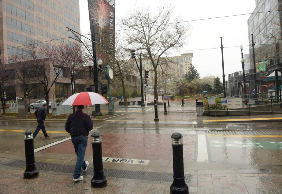 Al Hartmann  |  The Salt Lake Tribune
People cross Main Street mid-block crosswalk between 200 and 300 South just above the Gallivan Plaza Trax station. No fencing or cables are in place here, although it has more close-calls with pedestrians than the Gateway-Rio Grande area.