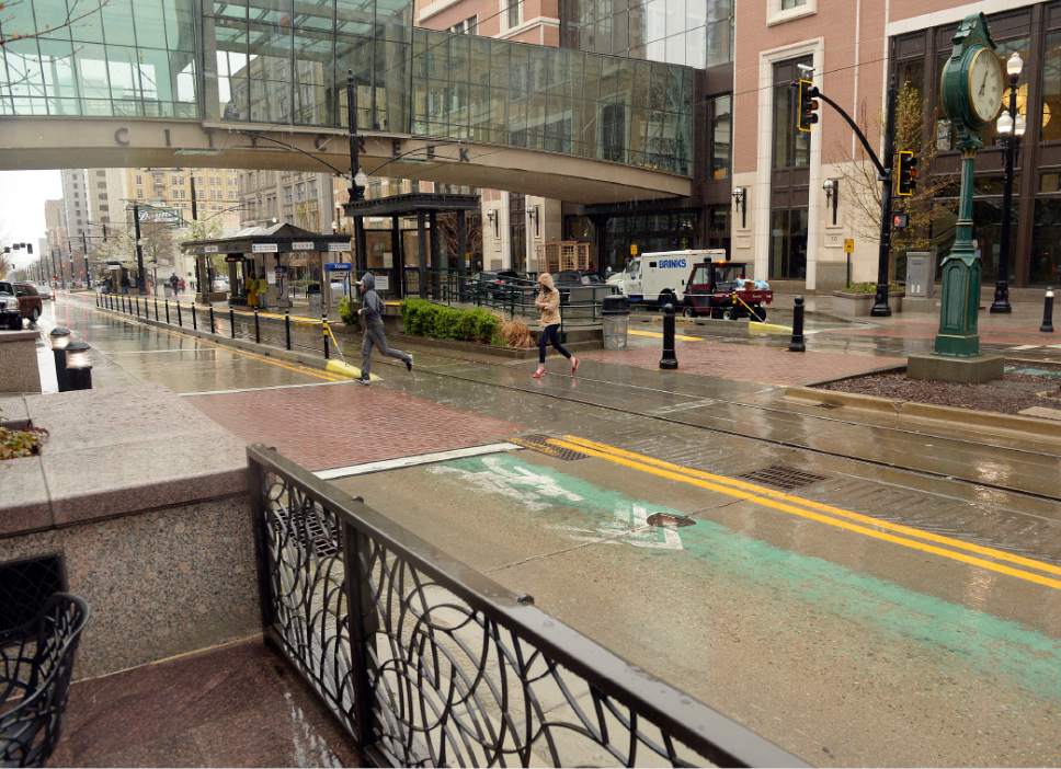 Al Hartmann  |  The Salt Lake Tribune
Cable barriers and decorative metal fences help funnel people to a mid-block pedestrian crossing at City Center Station at the City Creek Mall on Salt Lake City's Main Street.
