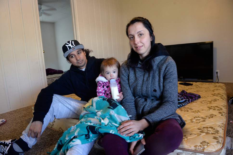 Al Hartmann  |  The Salt Lake Tribune
Mikala Manzanares and Josiah Beerle lived in a 2-bedroom apartment they originally got through Rapid Rehousing, a federal HUD program administered by The Road Home.
The place flooded ruining much of their furniture.  They have just moved their belongings into this new apartment with  Manzanares's three children, including eighteen-month-old Alayna