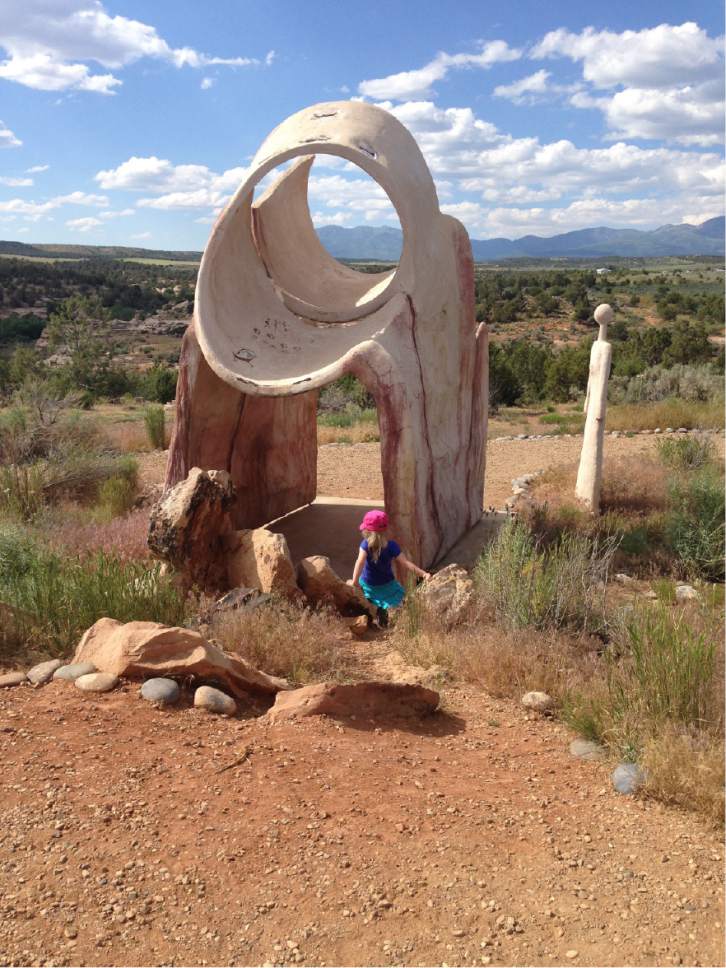 Erin Alberty  |  The Salt Lake Tribune

A young hiker approaches a sculpture at Edge of the Cedars State Park on June 11, 2016 in Blanding.